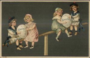 Easter - Kids on Fence w/ Giant Eggs c1910 Embossed Postcard
