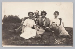 Group of Young Men Women in Fancy Dress laying on Ground RPPC Photo Postcard P3