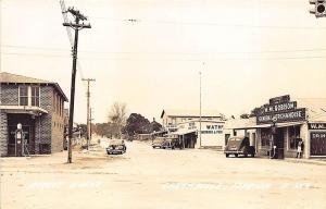 Carrabelle FL Street Scene Stores Gas Station Old Cars RPPC Postcard