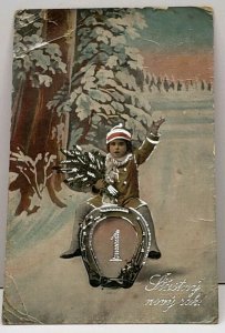 New Years Child Sledding on Horseshoe Silver Gild 1920 Europe to US Postcard G12
