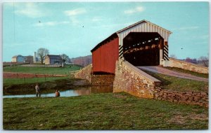 Bower's Covered Bridge with Amish farm in the background - Pennsylvania