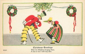 Art Deco Christmas Postcard W557 Christmas Wish Mistletoe Fancy Couple Bows
