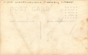 Postcard RPPC C-1910 Iowa Waterloo Creamery Street 4 men hats 23-13613