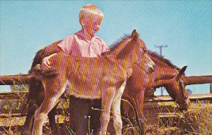 Young Boy Proud Of His Colts