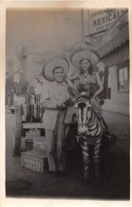 D69/ Interesting RPPC Postcard 1955 Tijuana Mexico Tourists Zebra Hats Man Woman