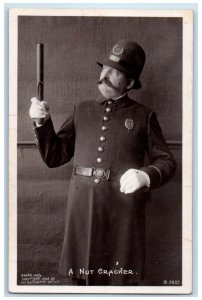 1911 British Policemen A Nut Cracker RPPC Photo Burst Iowa IA Antique Postcard