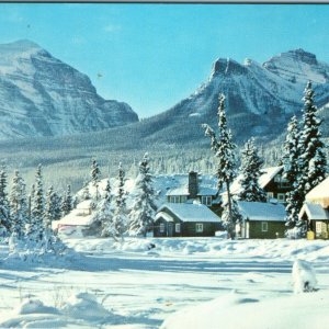c1960s Lake Louise AB Post Hotel Winter Postcard Snowy Mountain Rockies