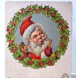 Christmas Postcard Santa Claus Pipe & Candy Cane Behind Decorated Wreath Emboss