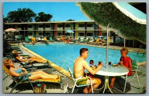Postcard Chicago IL c1960s Delta Motel Swimming Pool Women Sunbathing Defunct