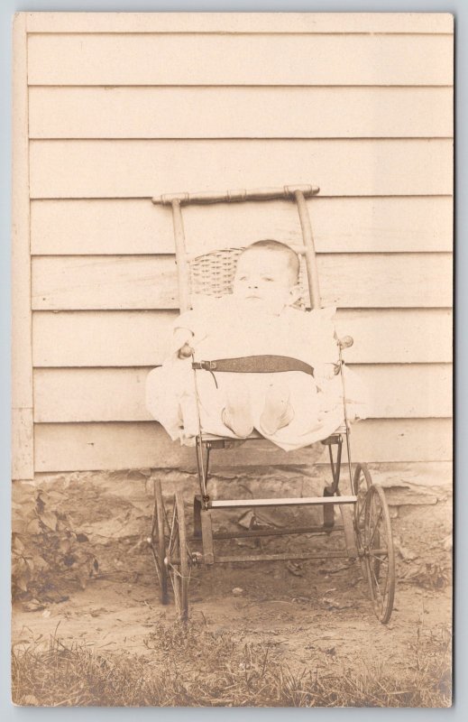 Real Photo Postcard~Baby in Little Wicker Stroller~Strapped In Buggy~c1910 RPPC 