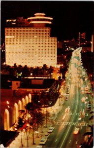 VINTAGE POSTCARD KALAKAUA AVENUE SCENE AT NIGHT WAIKIKI HAWAII 1970s