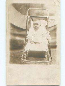 Pre-1918 rppc STUNNED LOOK ON BABY'S FACE IN STROLLER o2000