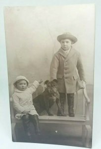 Vintage Antique Portrait Postcard Two small Children with their Pet Dog