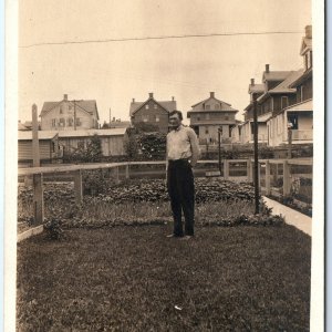 c1900s Town Backyard RPPC Man in Garden Fence Real Photo Postcard Houses Vtg A84