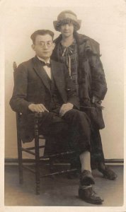 1924 RPPC Real Photo Postcard Couple Man Glasses Chair Woman Hat Fur Coat
