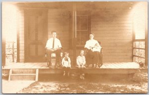 Young Family Photo on Front Porch House RPPC Vintage Postcard