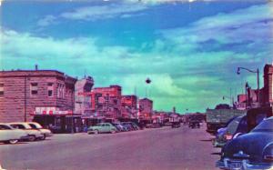 Cody WY Main Street Business District Old Car​s Postcard