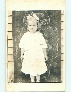 Pre-1930 rppc CUTE NERVOUS LOOKING GIRL WITH BOW IN HAIR r6175