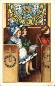 Christmas Children in Church Pews Stained Glass Peace Vintage Postcard