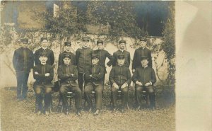 C-1910 Group men wearing Prouty hats RPPC Photo Postcard 20-3388