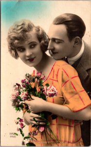 Hand Colored Real Photo Studio Postcard Man and Woman Embracing Flowers Romance