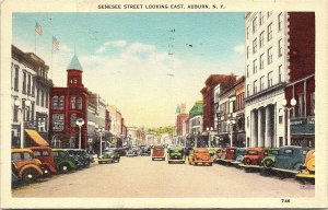 Postcard NY Auburn Genesee Street Looking East - OLD CARS - DRUG STORE 1937 A6