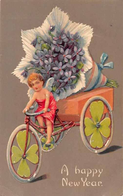 New Year Greetings Angel Riding Bicycle with Flowers Antique Postcard J59877