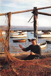 BR90103 mending the nets peche fishing boat   uk