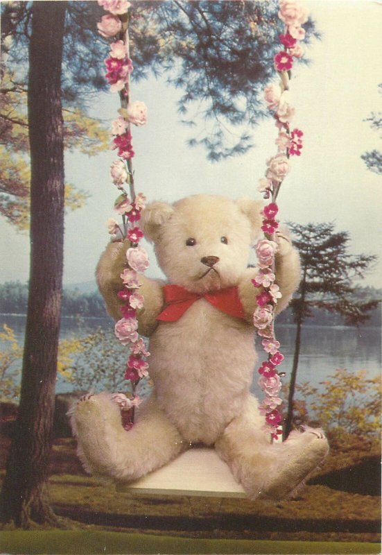 Postcard handmade Timothy teddy bear on swing crafted by Linda Spiegel