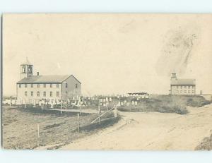 1920's rppc GRAVEYARD CEMETERY IN FRONT OF CHURCH - HALLOWEEN INTEREST HM0558