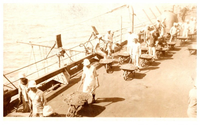 WW 1  Loading Coal on ship , by hand