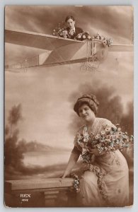 RPPC Pretty Lady And Man Flying Airplane Above Studio Prop Postcard N25