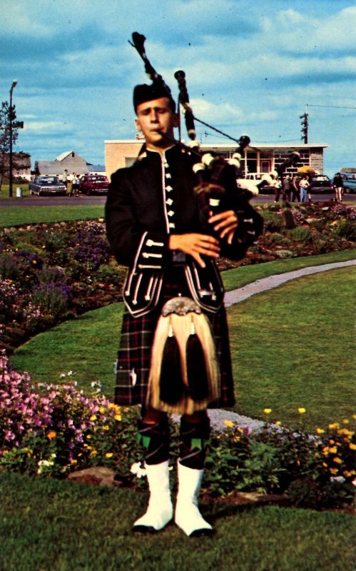 Canada - Nova Scotia. Piper in Tartan Dress