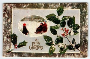 Christmas Postcard Children Outside Holly Leaves Embossed 1909 Vintage Greeting