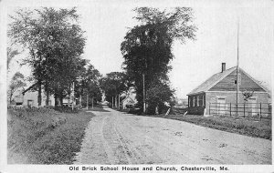 Chesterville ME Dirt Street Old Brick School House and Church Postcard