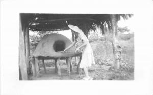 1950s Woman baking Mexican Oven RPPC real photo postcard 7581