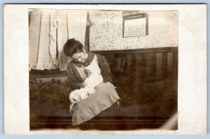 1908 RPPC WARREN-EHRET CO CALENDAR ON WALL*WOMAN & INFANT*BABY*FLORENCE YODER 