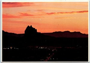 Sunset silhouettes the giant Shiprock formation - Shiprock, New Mexico