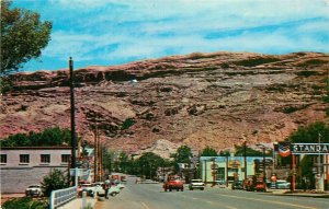 Postcard 1950s Utah Moab Main looking South Gas Station pumps Standard UT24-3016