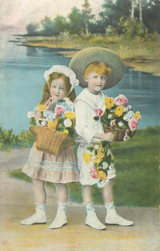 Lovely children couple early greetings postcard