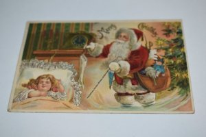 Merry Christmas Sleeping Child Santa Claus with Sack of Toys Fireplace Postcard
