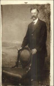 Man w/ Wild Moustache Poses - Norwich CT Written on Back c1910 RPPC