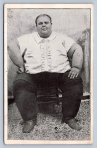 J94/ Interesting Postcard c1910 Side Show Freak Fat Man Chair  400