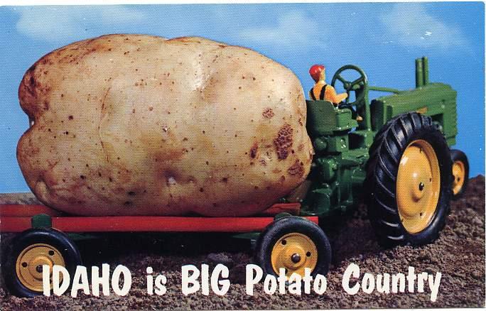 Idaho is Big Potato Country - John Deere Tractor towing a Potato