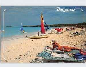 Postcard Sandy beaches, clear turquoise-blue waters, colorful sails, Bahamas