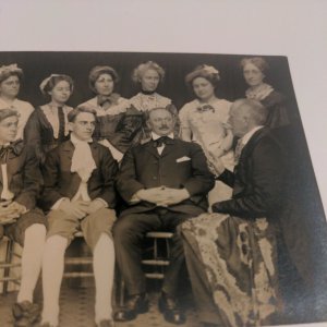 Real Photo Postcard Men Sitting Woman Standing