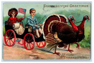 1910 Thanksgiving Greetings Turkeys Pulling Wagon With Boy And Girl Postcard