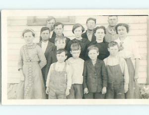 Pre-1918 rppc TWO BOYS WEARING OVERALLS JEANS IN GROUP SHOT r5896