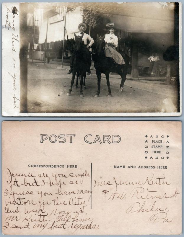 U.S. STREET SCENE COUPLE ON HORSES ANTIQUE REAL PHOTO POSTCARD RPPC w/ FLAGS