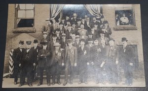 RPPC Portrait Group Men in front of building. Medals. Bardwell Porter KRUXO